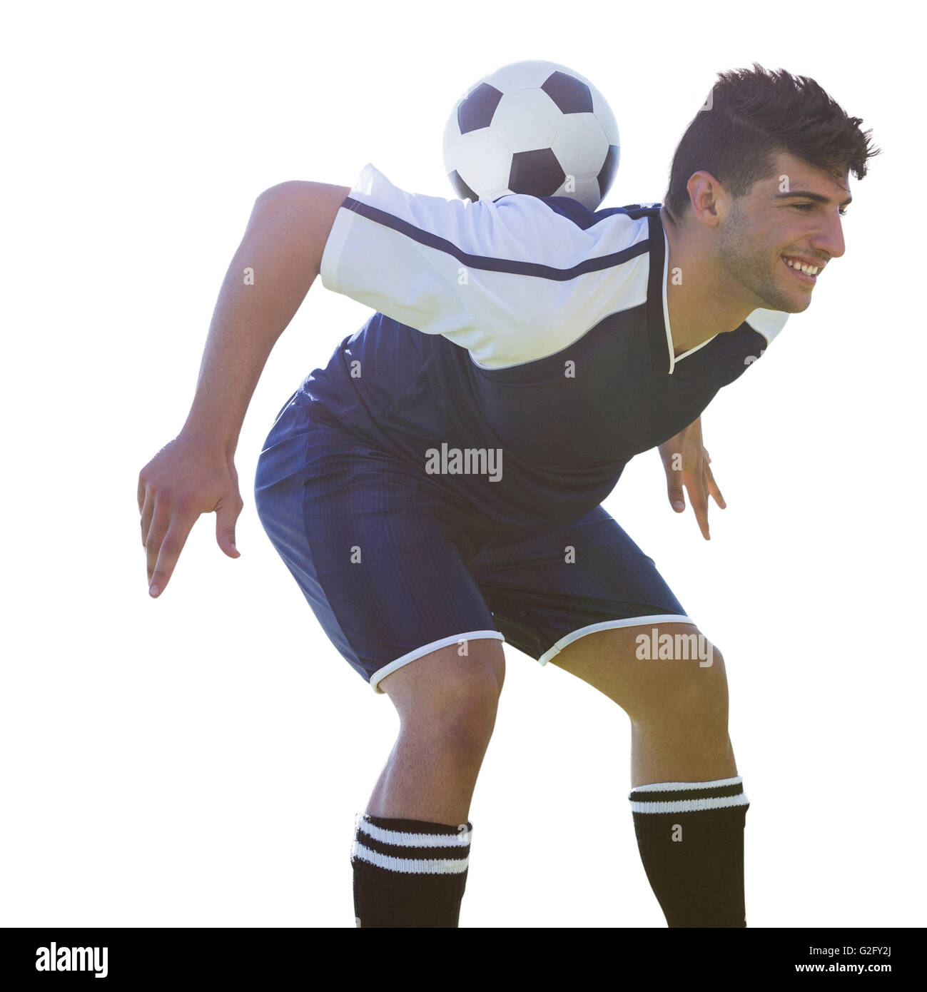 L'uomo giocatore di calcio mantenendo la sfera sulla sua schiena Foto Stock