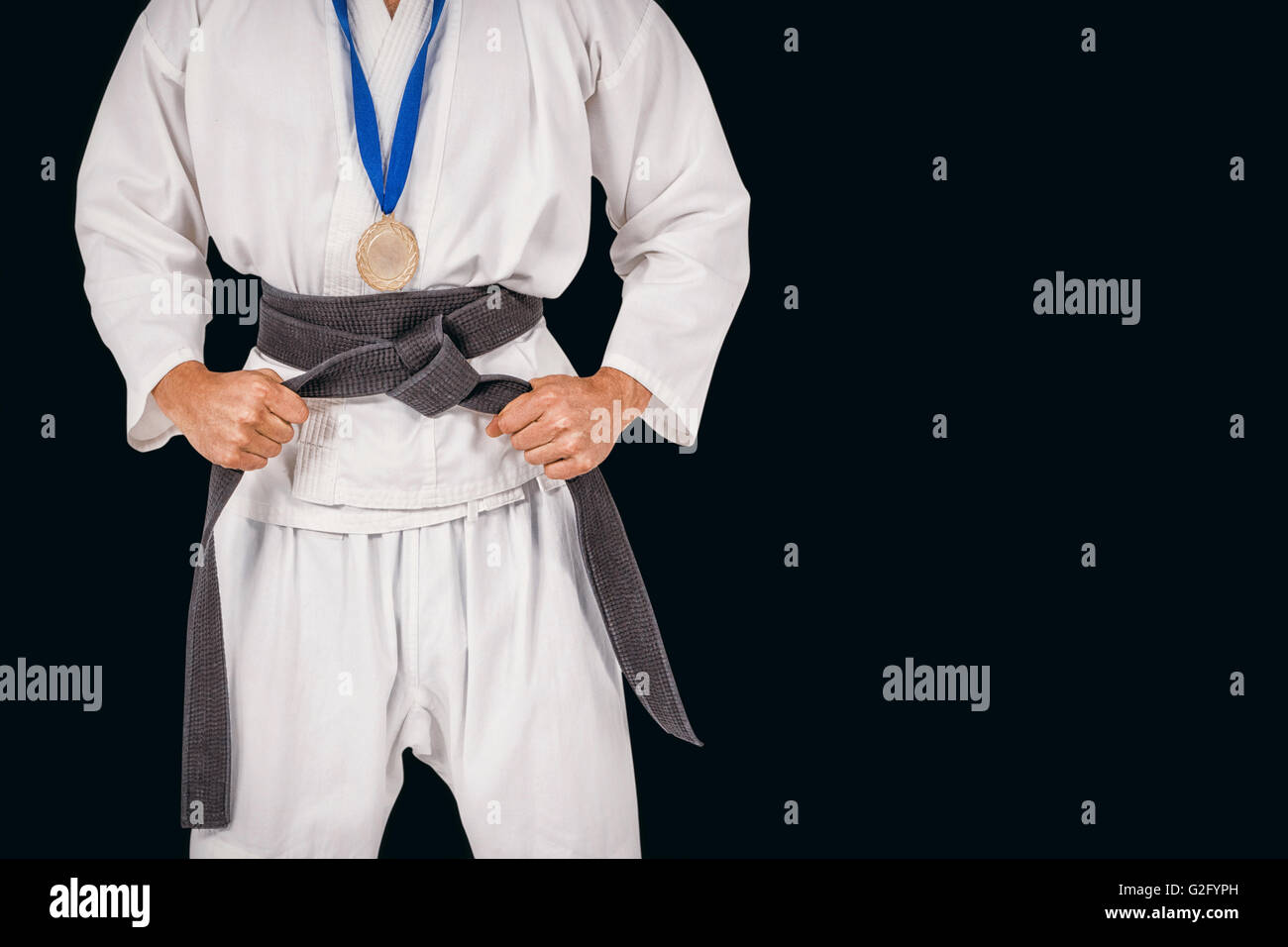 Immagine composita del fighter in posa con medaglia intorno al suo collo Foto Stock