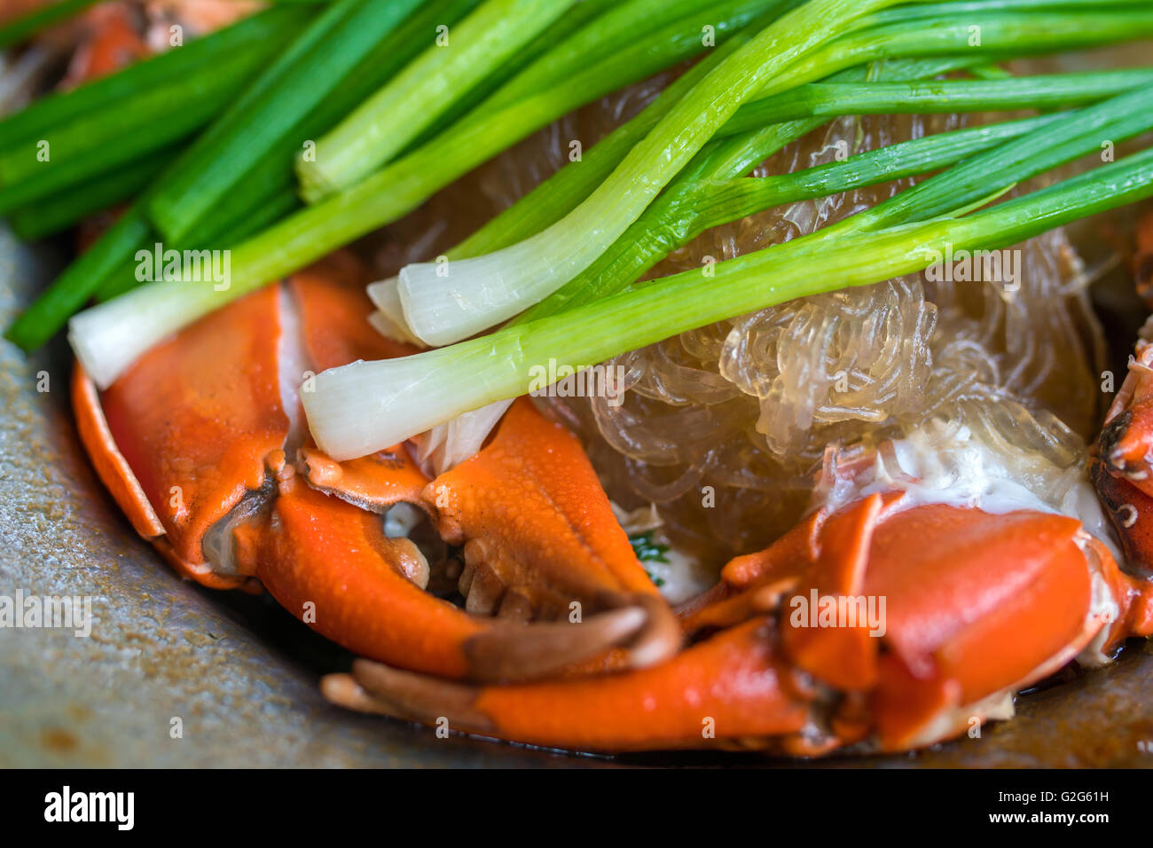 Il granchio con spaghetti di vetro Foto Stock