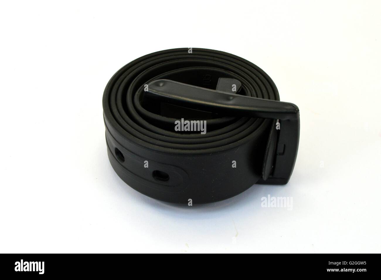 Cinghia del pantalone in plastica di colore nero. Foto Stock