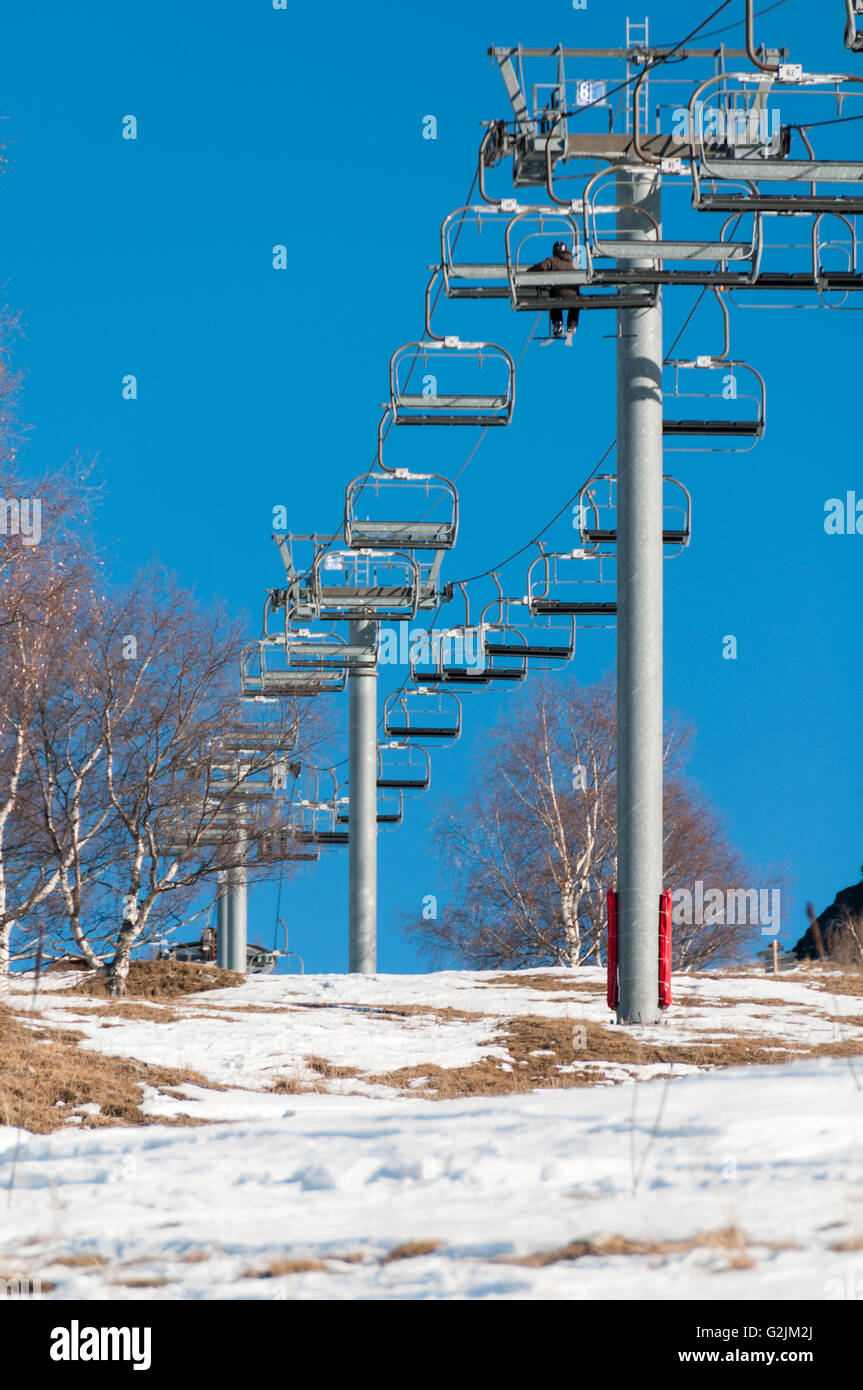 Uomo su ski-lift Foto Stock