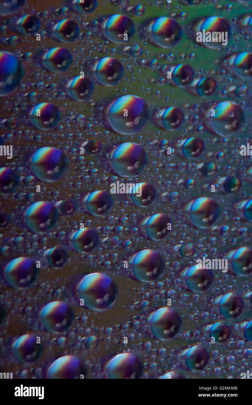 Colorato astratto watter cade closeup su cd Foto Stock