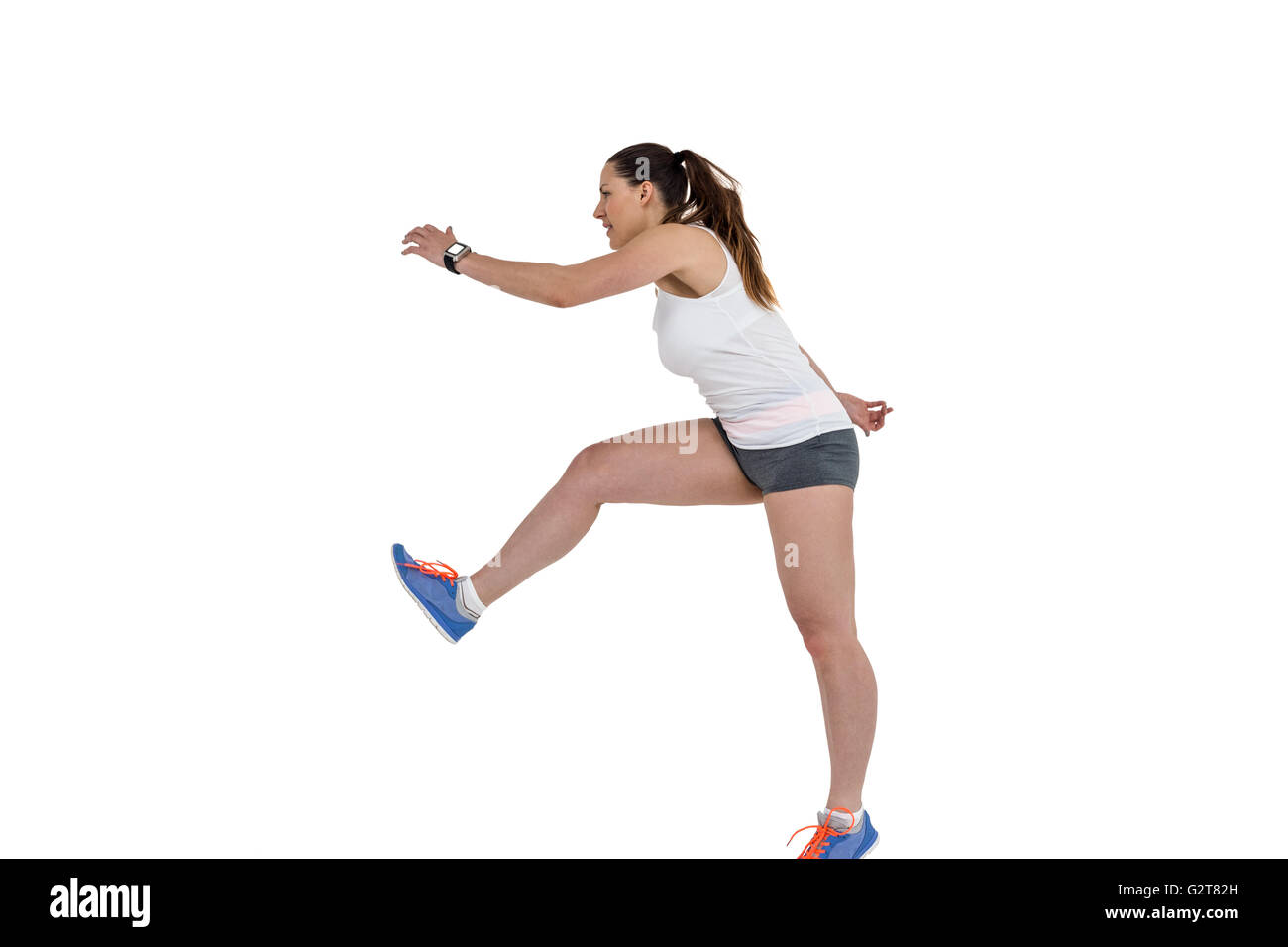 Atleta donna in esecuzione su sfondo bianco Foto Stock