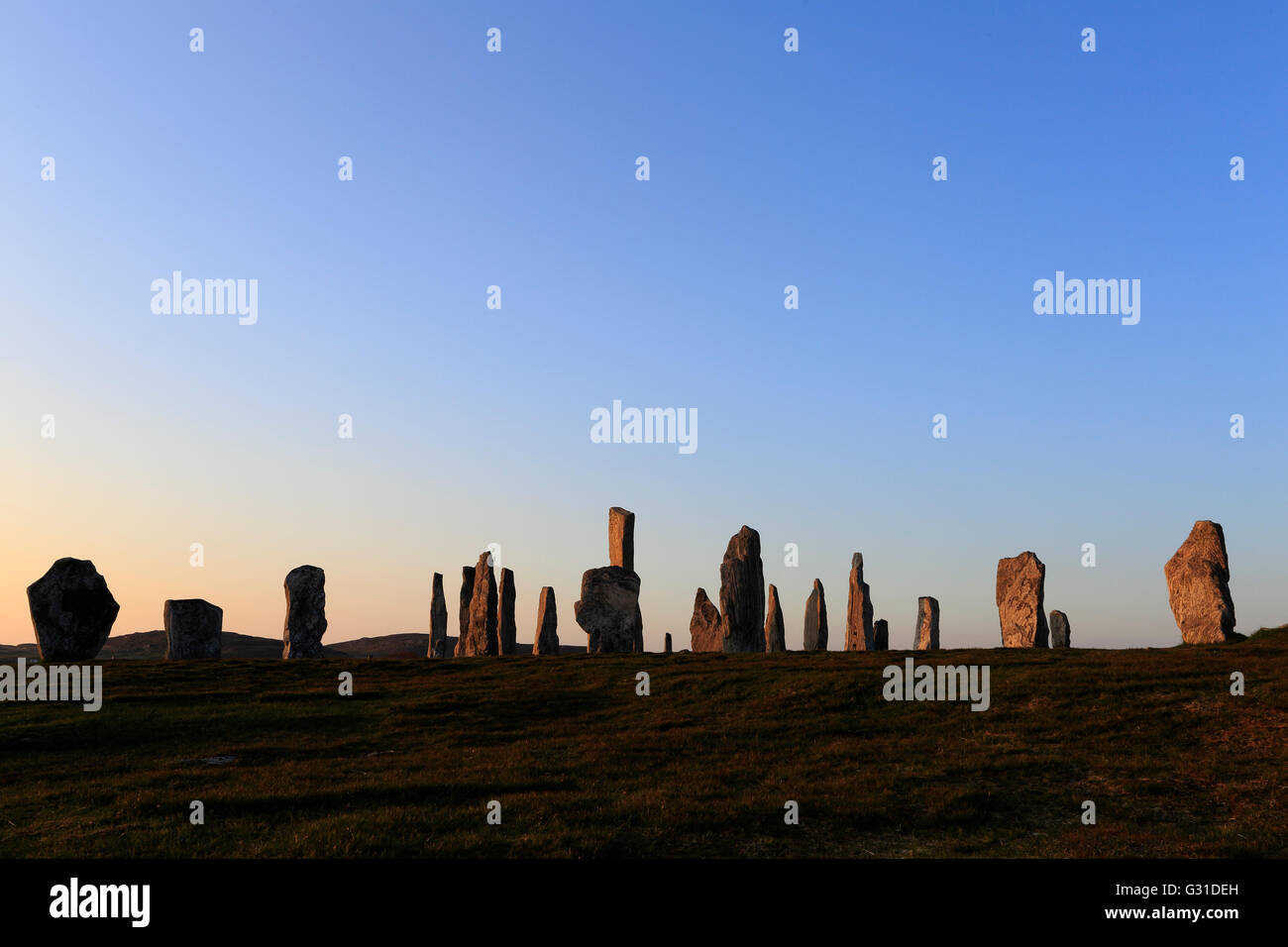 Callanish pietre permanente al tramonto Foto Stock