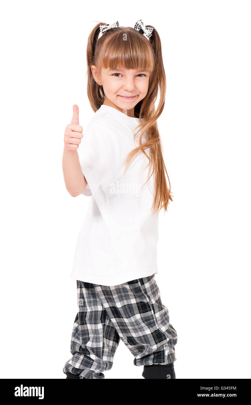 Felice bambina mostrando pollice in alto Foto Stock