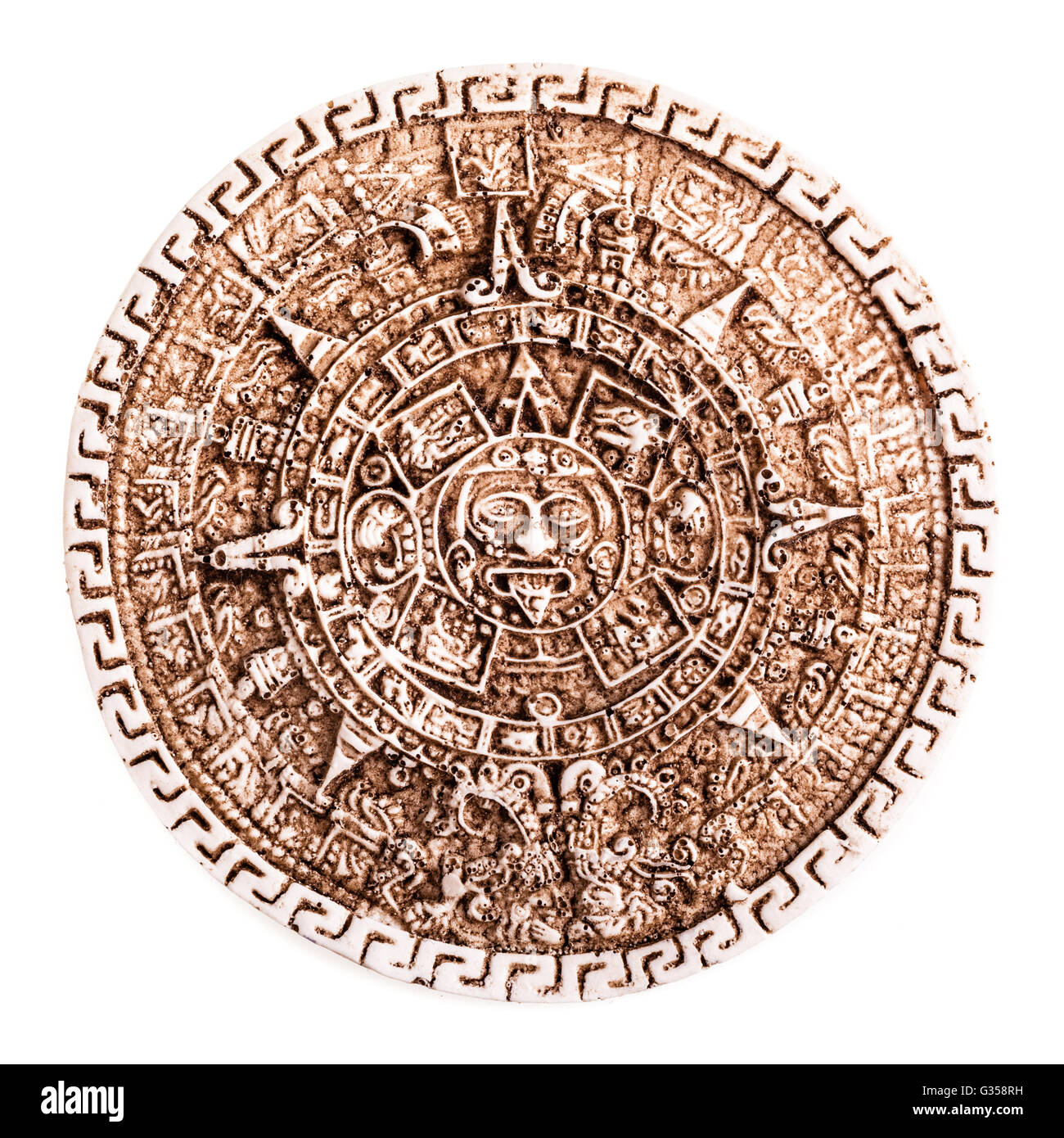 Stone calendario maya coaster souvenir dal Messico isolate su uno sfondo bianco Foto Stock