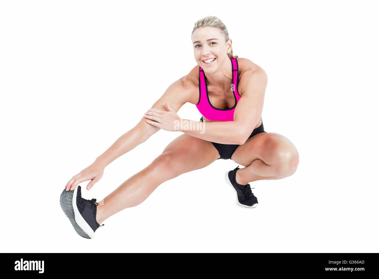 Atleta femminile stretching Foto Stock