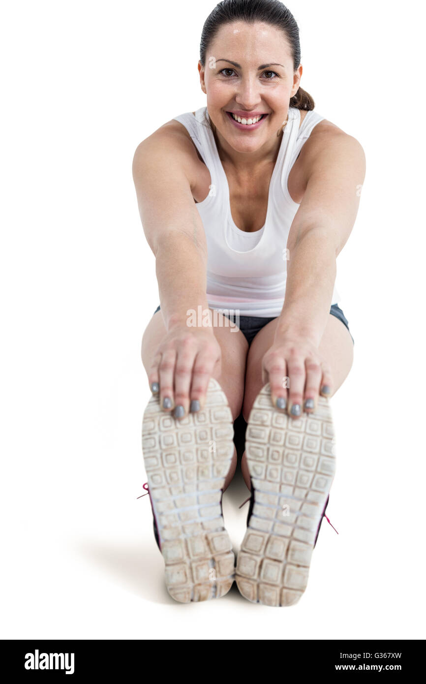 Ritratto di atleta donna facendo esercizio di stretching Foto Stock