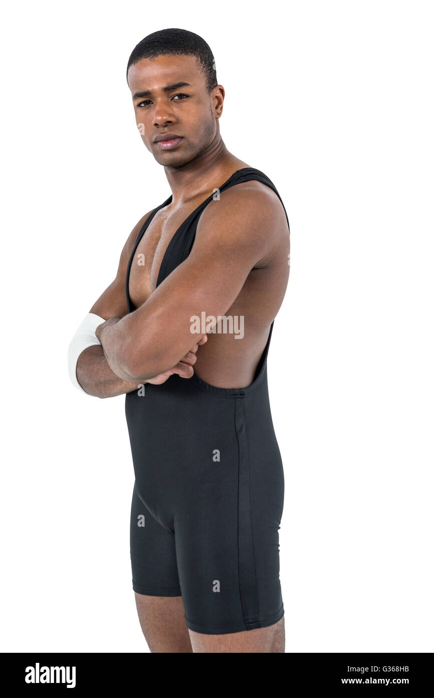 Atleta in posa con le braccia incrociate Foto Stock