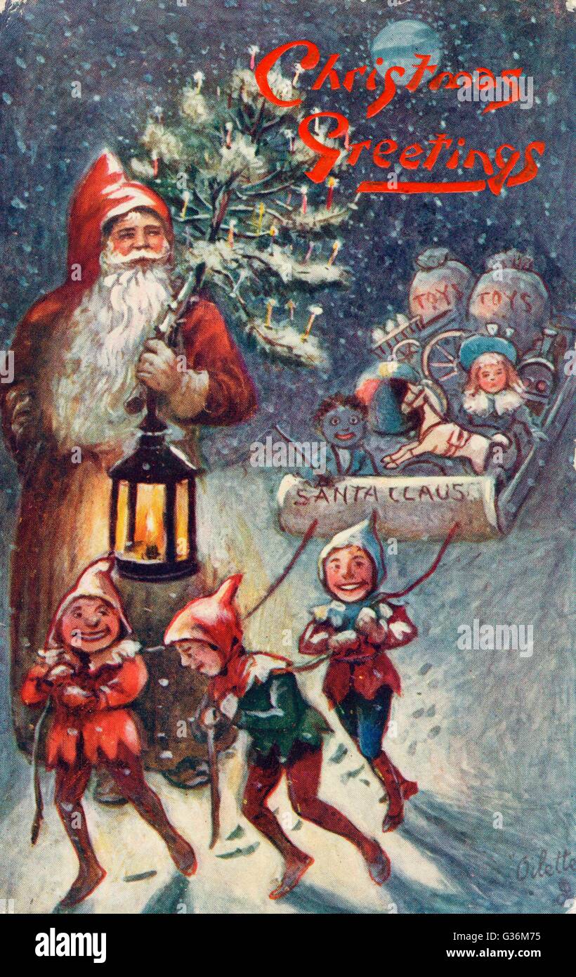 Babbo Natale e gli elfi che tirano la slitta Foto Stock