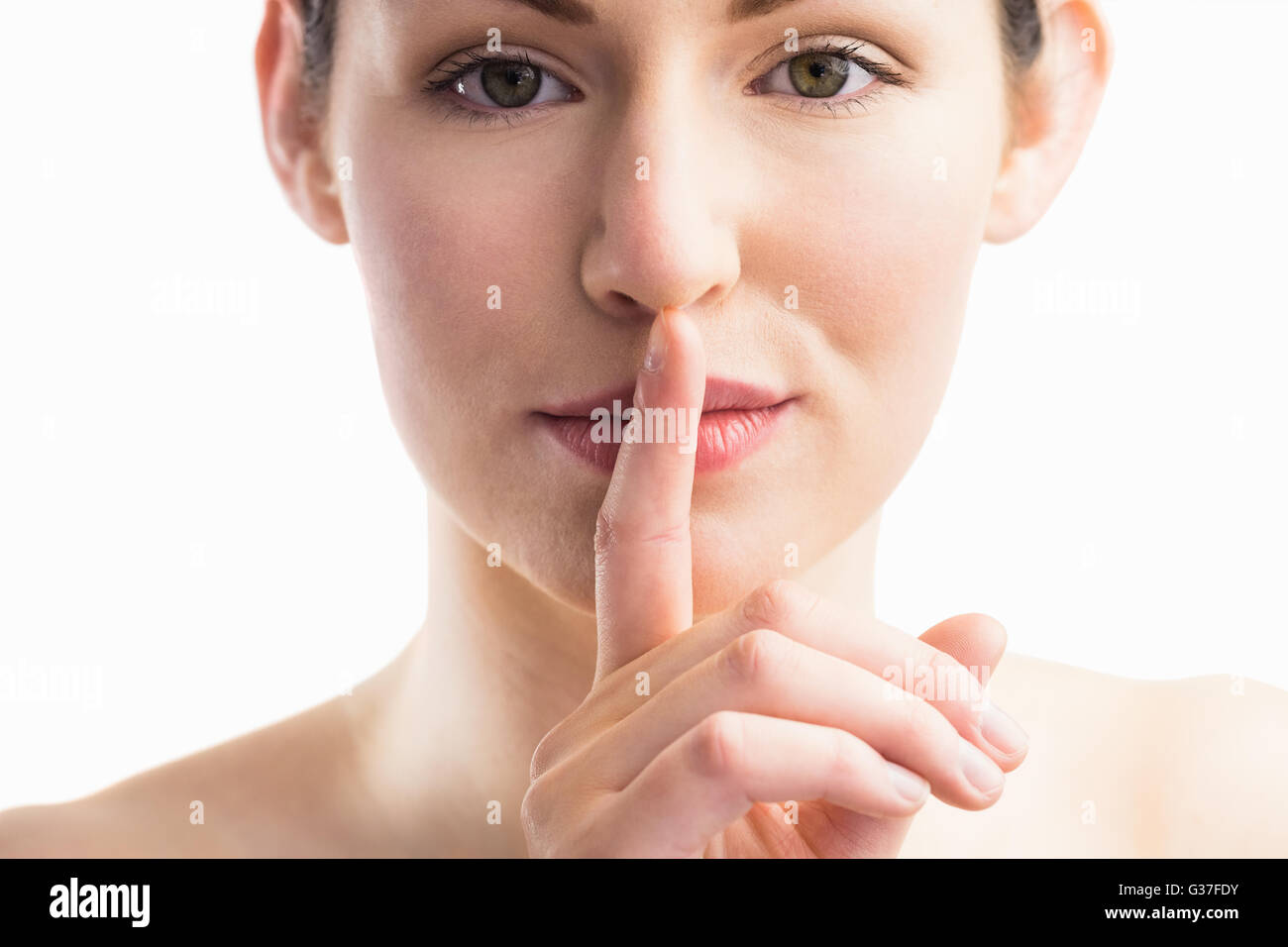 Focus sulla donna con il suo dito sulla bocca Foto Stock