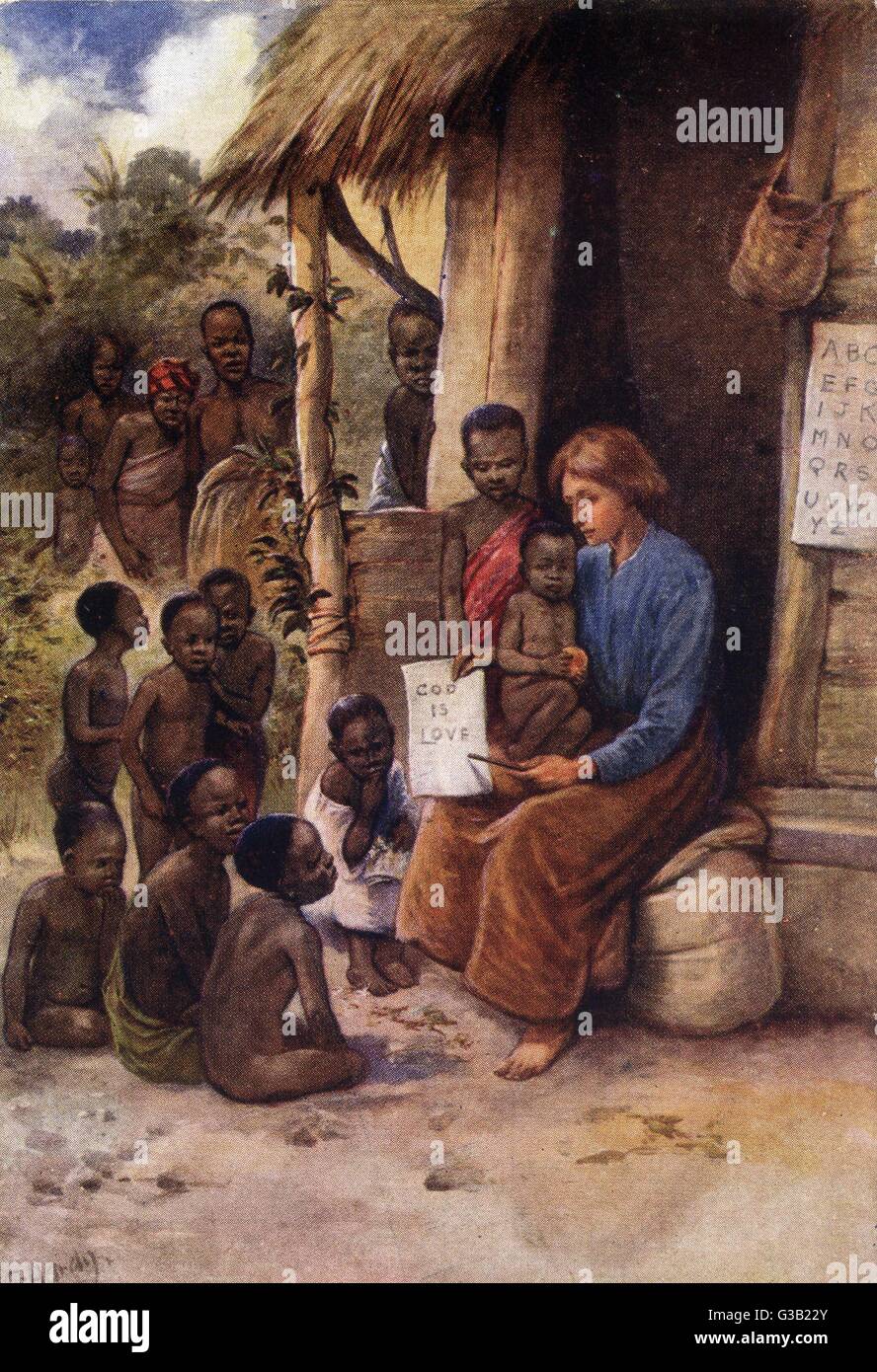 Un missionario insegna i suoi alunni che " Dio è amore " Data: circa 1910 Foto Stock