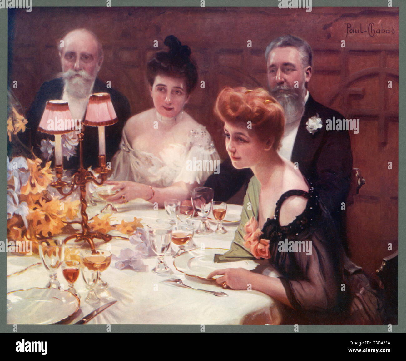 Una conversazione in corso durante una cena. Data: 1905 Foto Stock