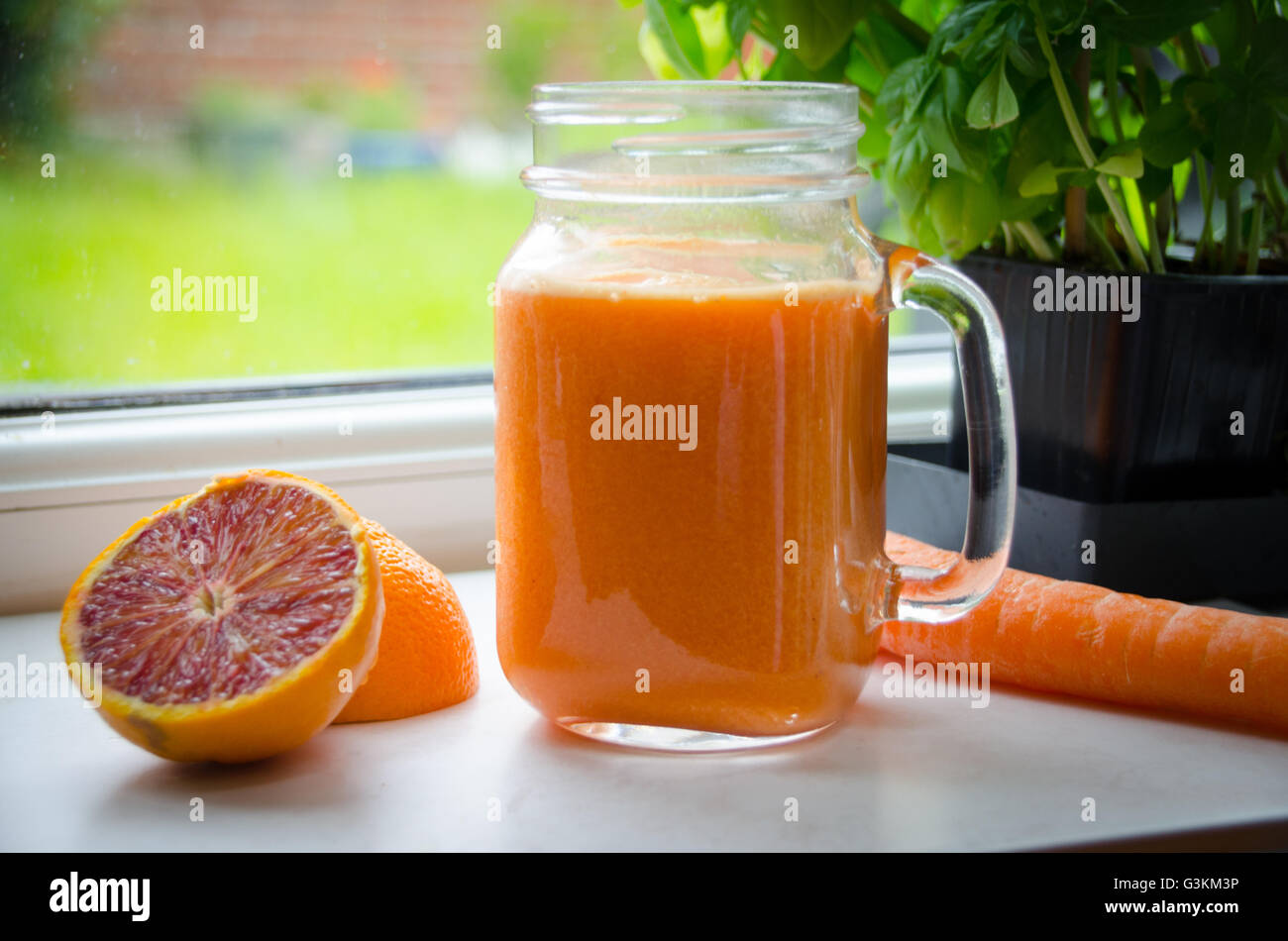 Arancione e il succo di carota, succhi sani Foto Stock