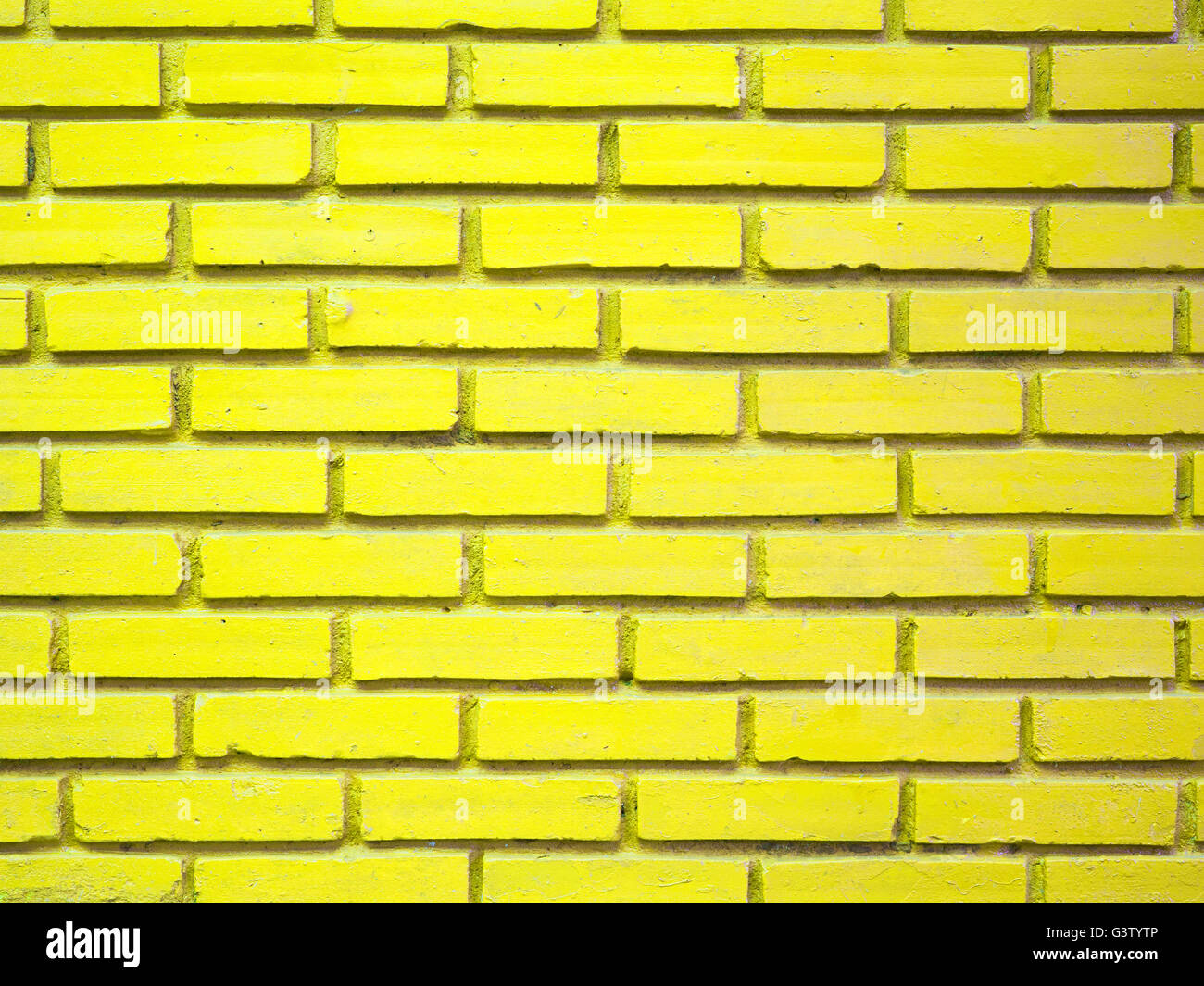 Mattone giallo parete sfondo texture Foto Stock