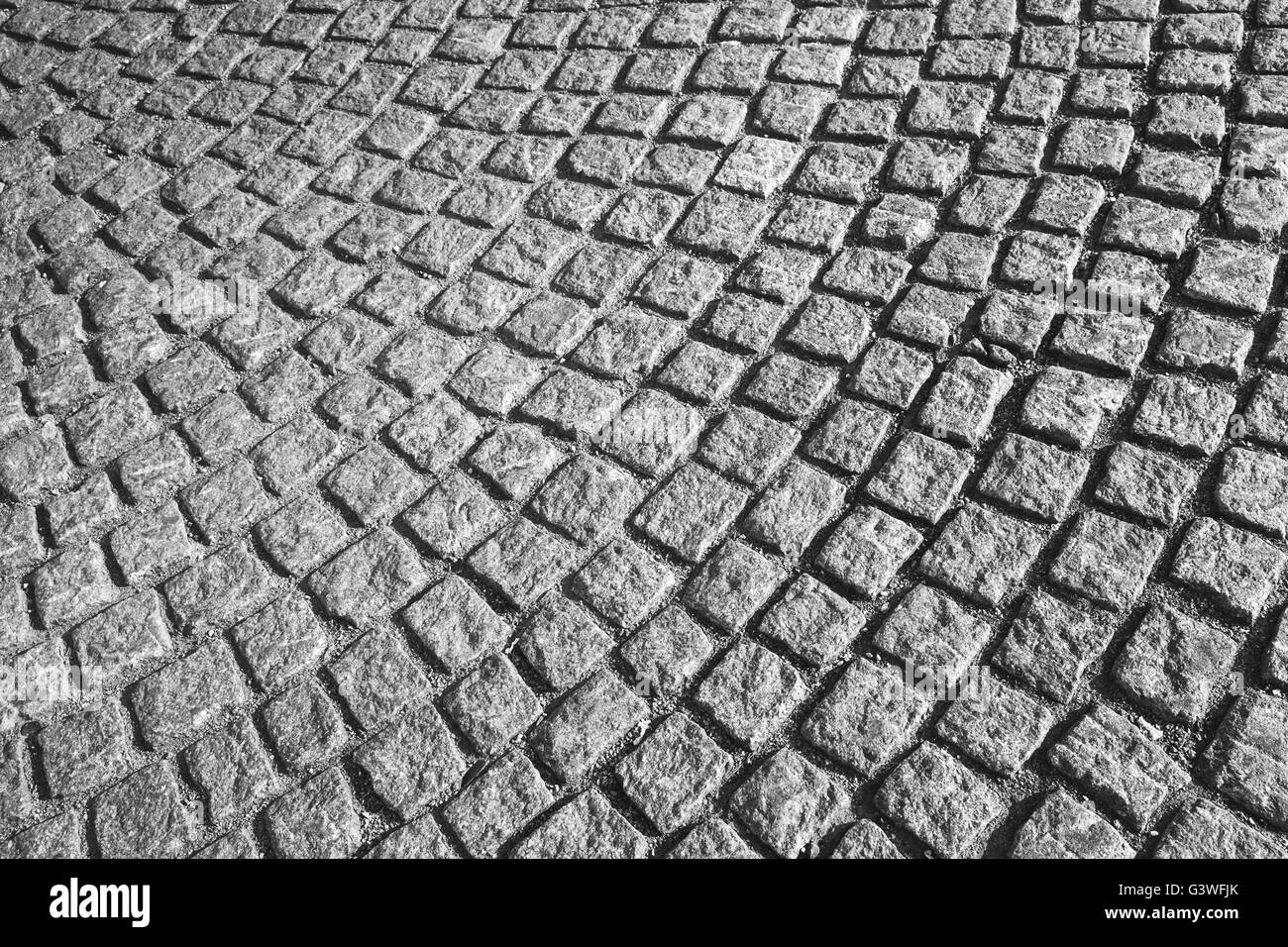 Grigio strada acciottolata marciapiede con rotondi, urban texture di sfondo Foto Stock
