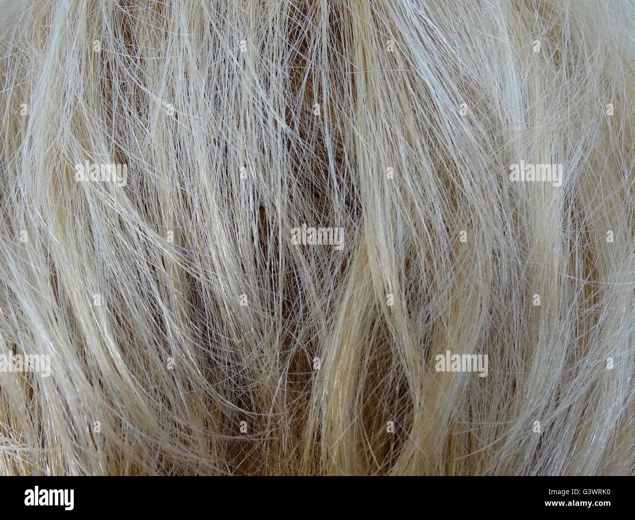 Capelli biondi come sfondo o immagine di sfondo Foto Stock
