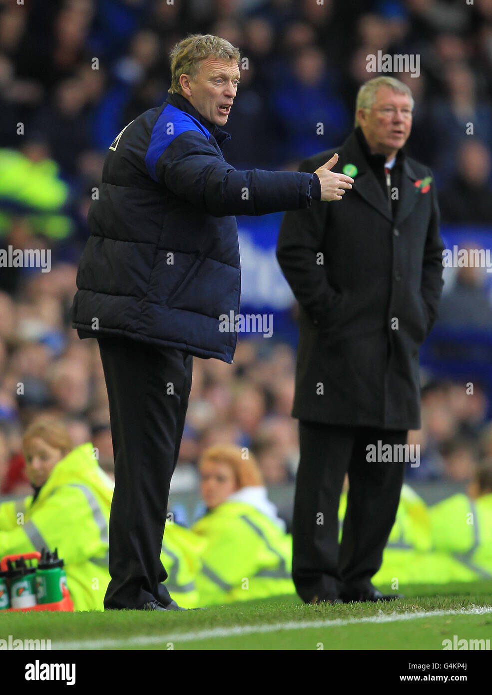 David Moyes (L), manager di Everton, e Sir Alex Ferguson la linea di contatto Foto Stock