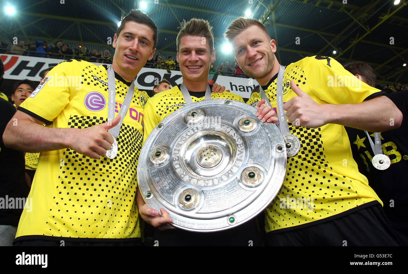 Il Polacco BVB Borussia Dortmund giocatori, da sinistra, Robert Lewandowski, Lukasz Piszczek e Jakub Kuba Baszczykowsi tenendo premuto il Foto Stock