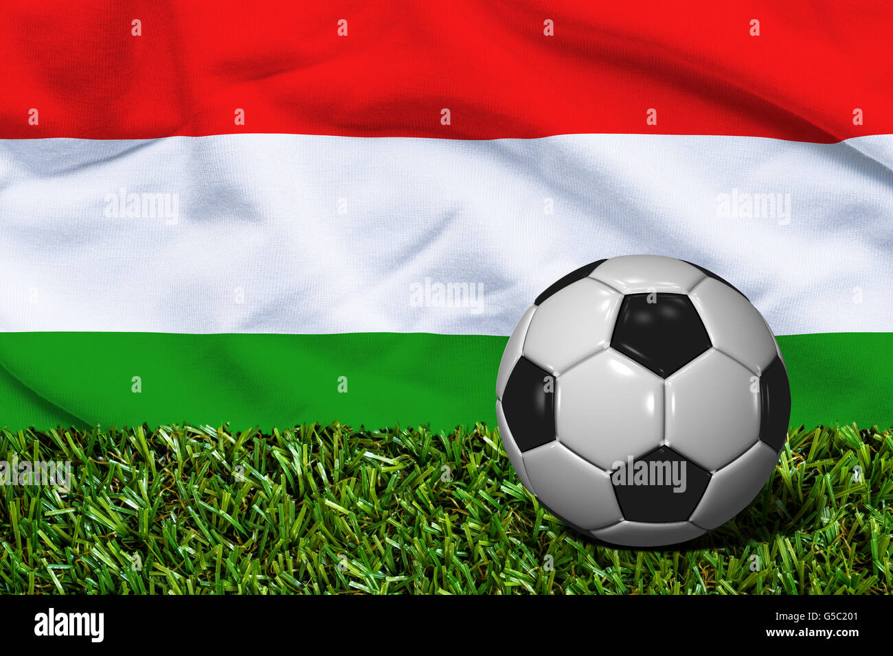 3D reso pallone da calcio in erba campo con Ungheria bandiera come sfondo Foto Stock