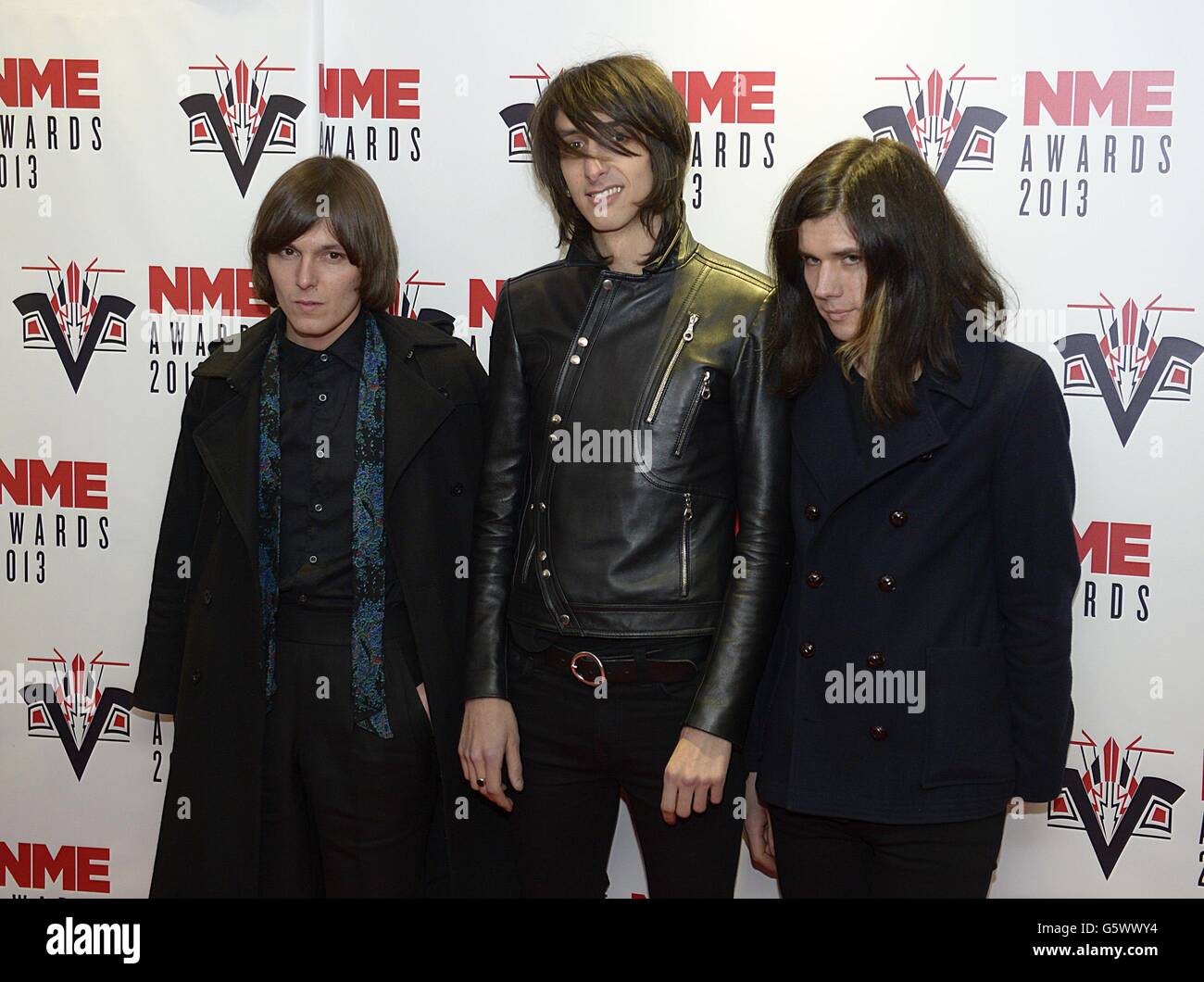 (Da sinistra a destra) Rhys Webb, Faris Badwan e Joshua Hayward degli orrori in arrivo per i 2013 NME Awards, al Troxy, Londra. Foto Stock