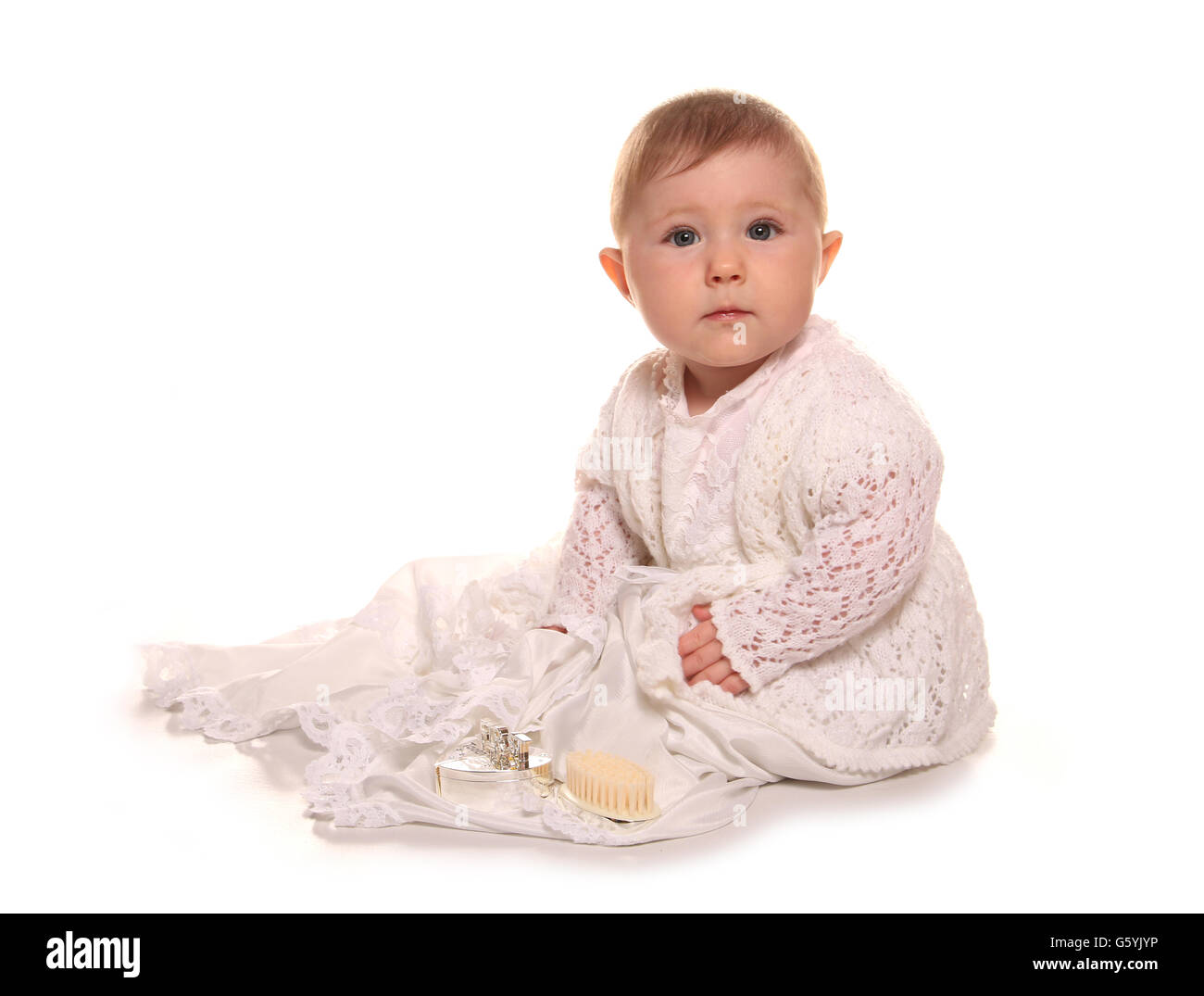 Baby ragazza in un abito battesimo ritaglio Foto Stock