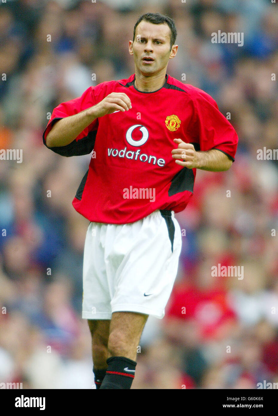 Il giocatore Manchester United Ryan Giggs in azione contro Boca Juniors durante il gioco pre-stagione amichevole a Old Trafford. Foto Stock