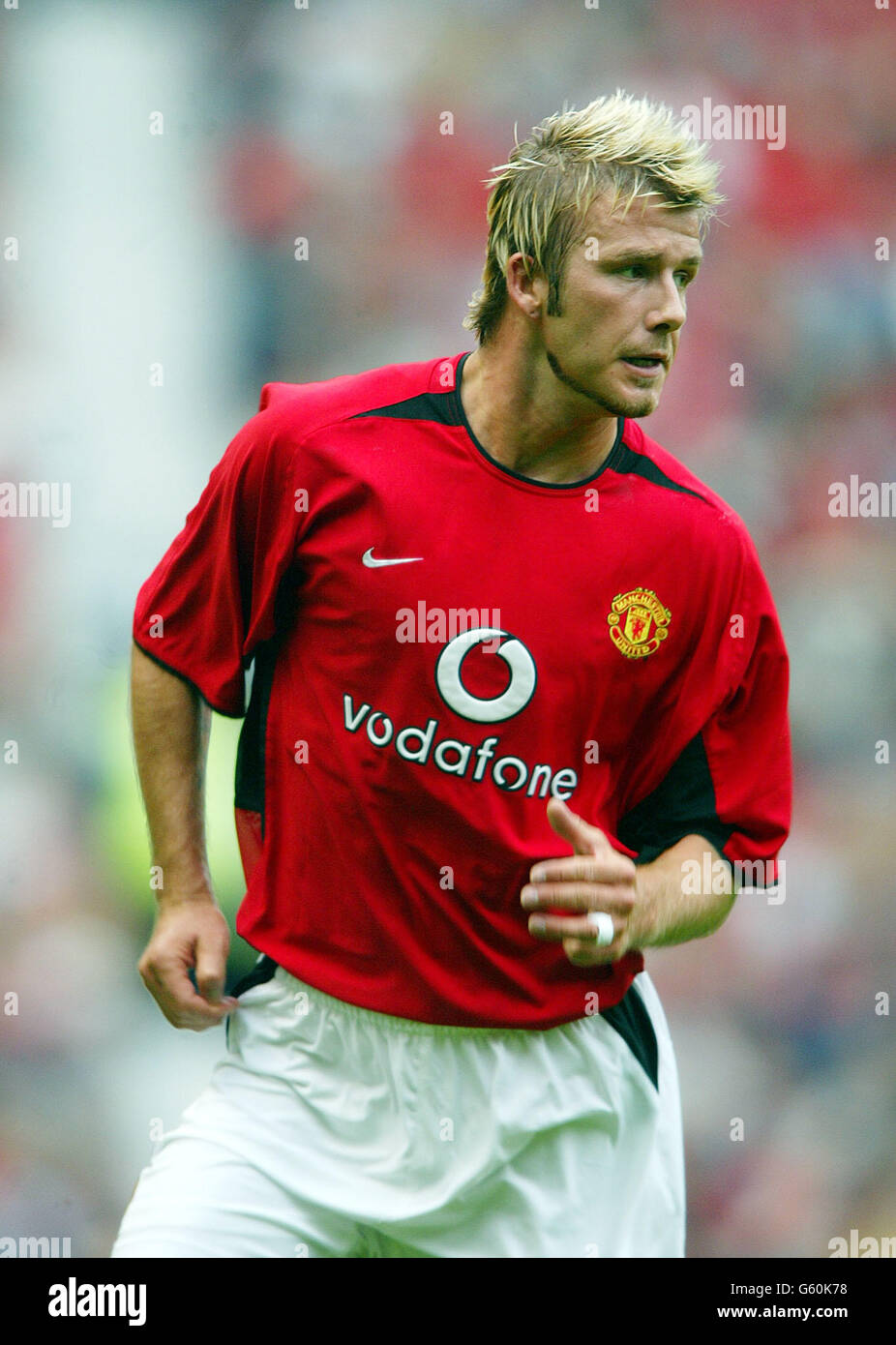 Il giocatore Manchester United David Beckham in azione contro Boca Juniors durante il gioco pre-stagione amichevole a Old Trafford. Foto Stock