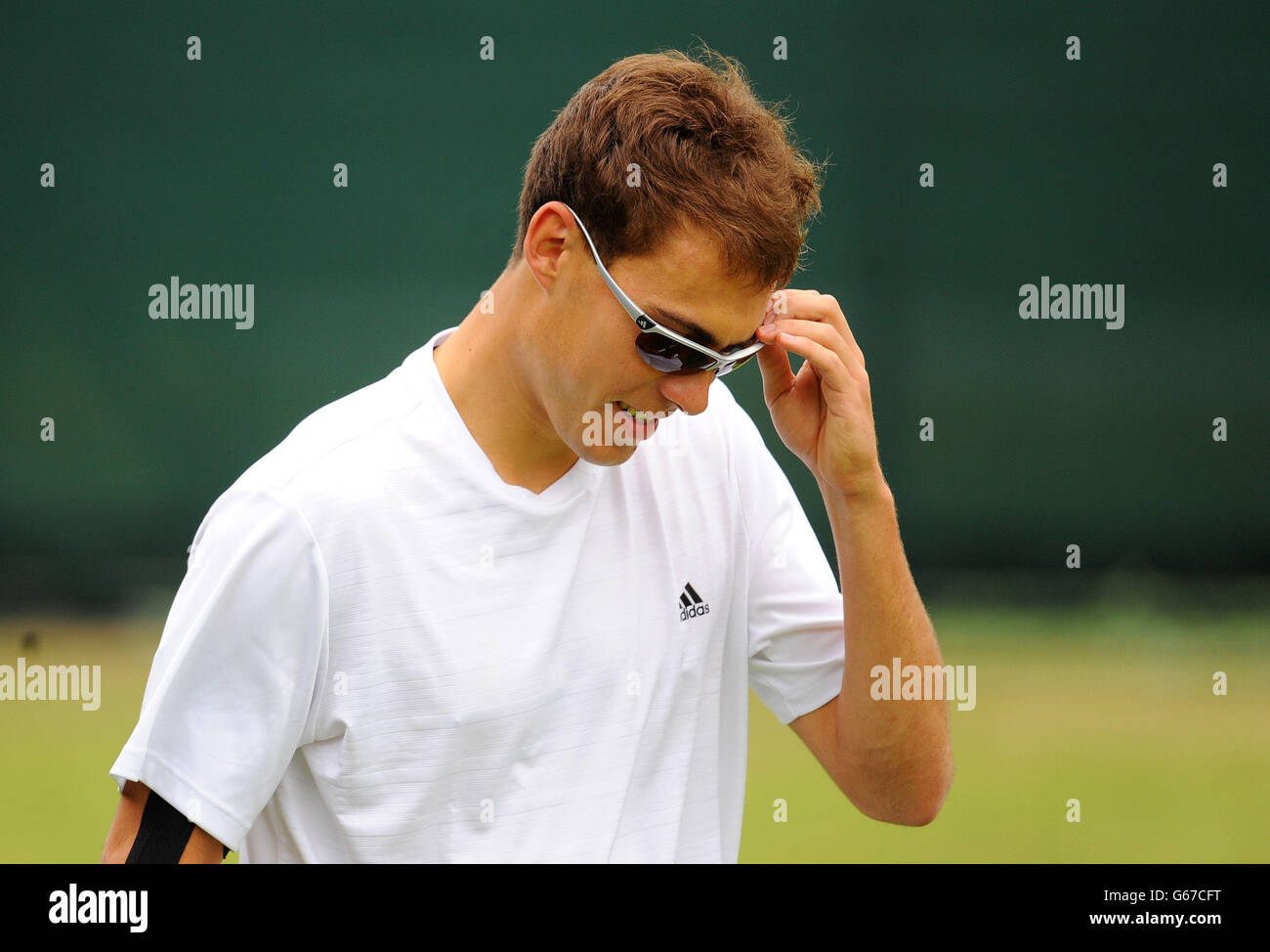 Jerzy Janowicz in Polonia in una sessione di pratica durante il giorno 10 dei Campionati di Wimbledon all'All England Lawn Tennis and Croquet Club di Wimbledon. Foto Stock