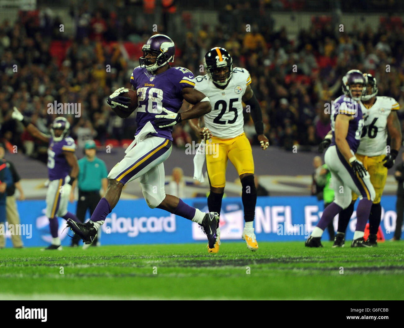 Adrian Peterson dei Minnesota Vikings corre per segnare un touchdown Foto Stock