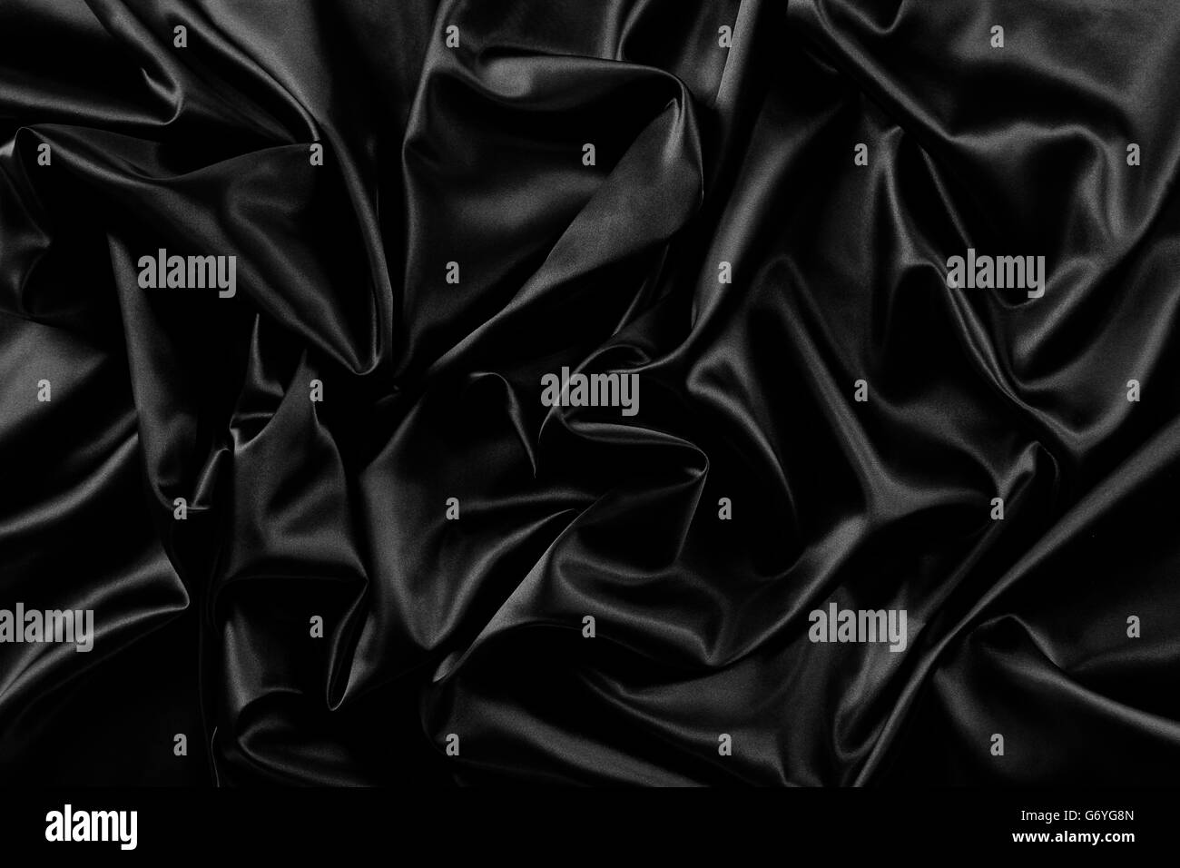 Primo piano della increspata nero in tessuto di seta Foto Stock