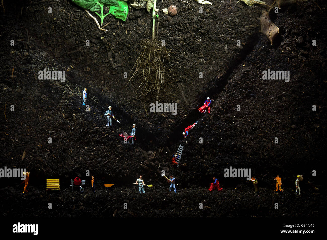 Minatori concettuale in una miniera sotterranea Foto Stock