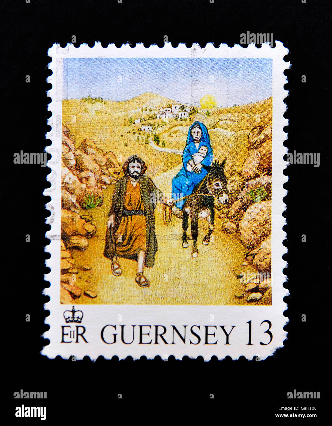 GUERNSEY - circa 1979: un timbro stampato in Guernsey che mostra la scena biblica di Gesù la fuga in Egitto, circa 1979 Foto Stock