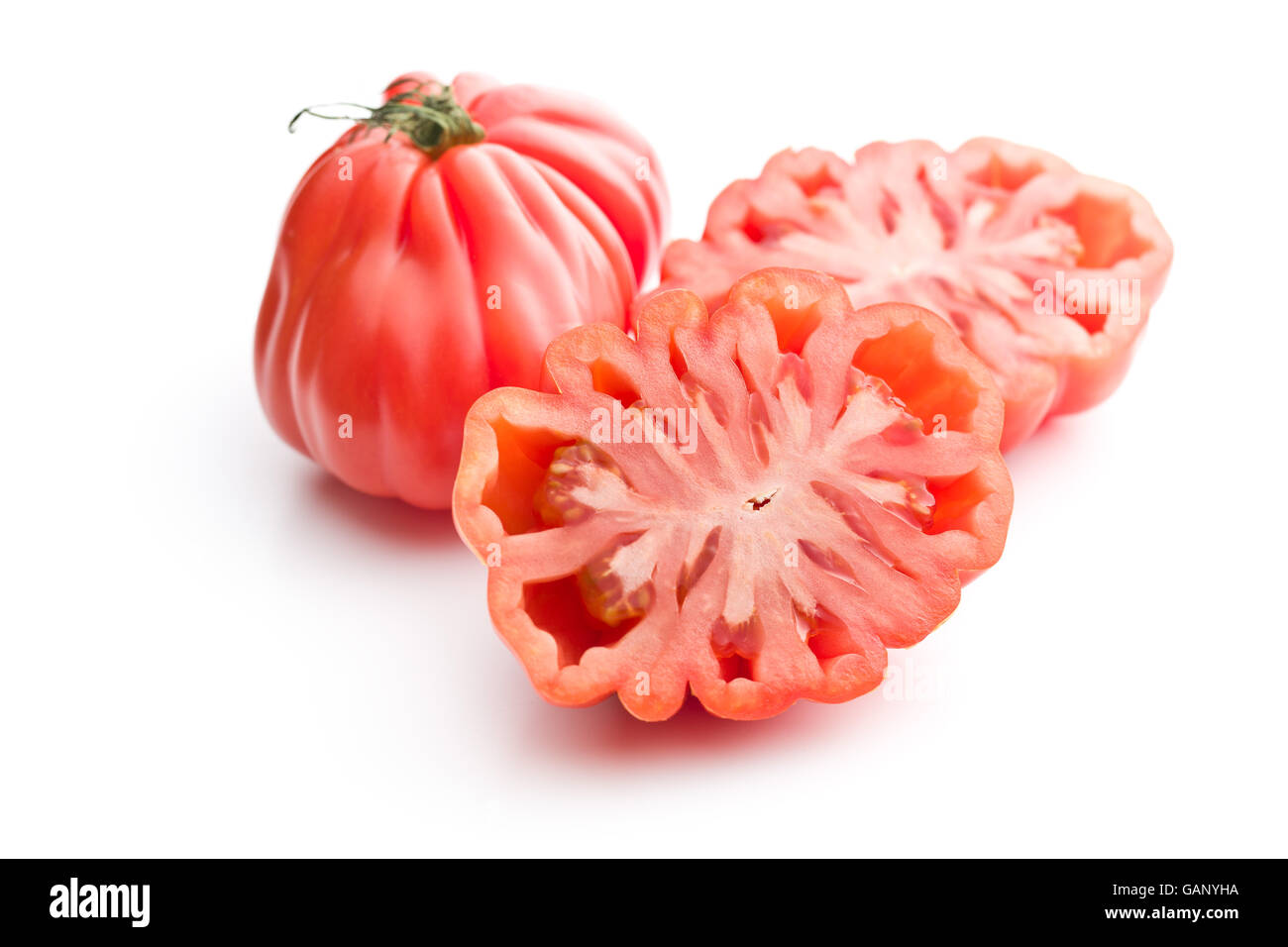 Coeur de boeuf. Bistecca di manzo pomodori isolati su sfondo bianco. Foto Stock