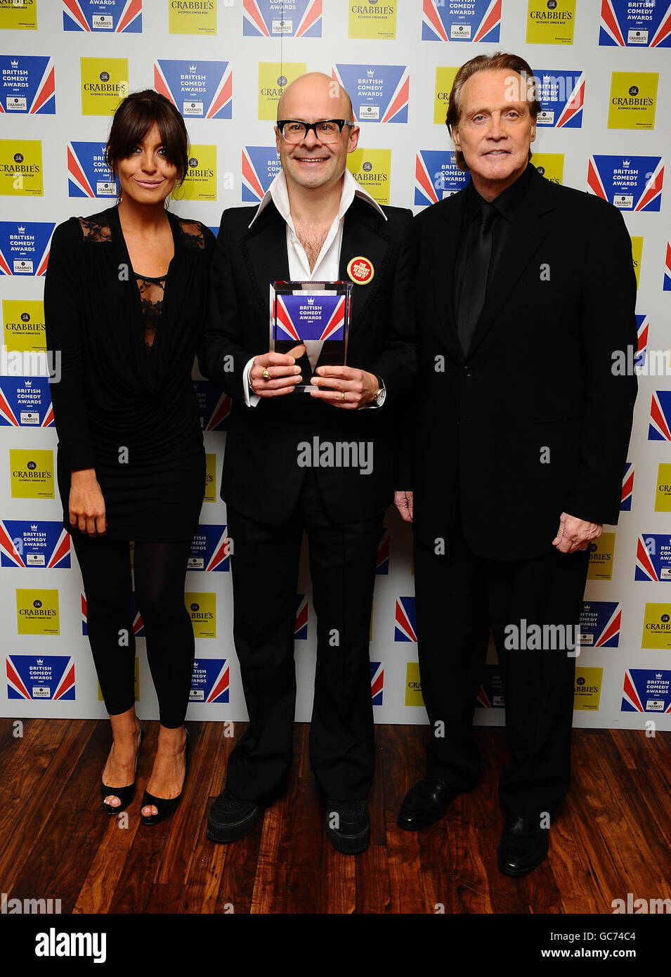 Harry Hill (centro) vince la migliore personalità commedia di intrattenimento, presentata da Claudia Winkleman e Lee Majors ai British Comedy Awards 2009 presso gli Studios televisivi di Londra. Foto Stock