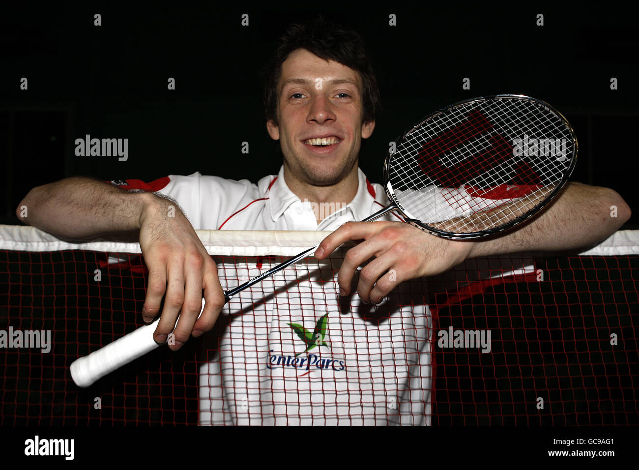 Inghilterra il giocatore di Badminton Carl Baxter si pone durante la fotocellula al National Badminton Center, Milton Keynes. Foto Stock