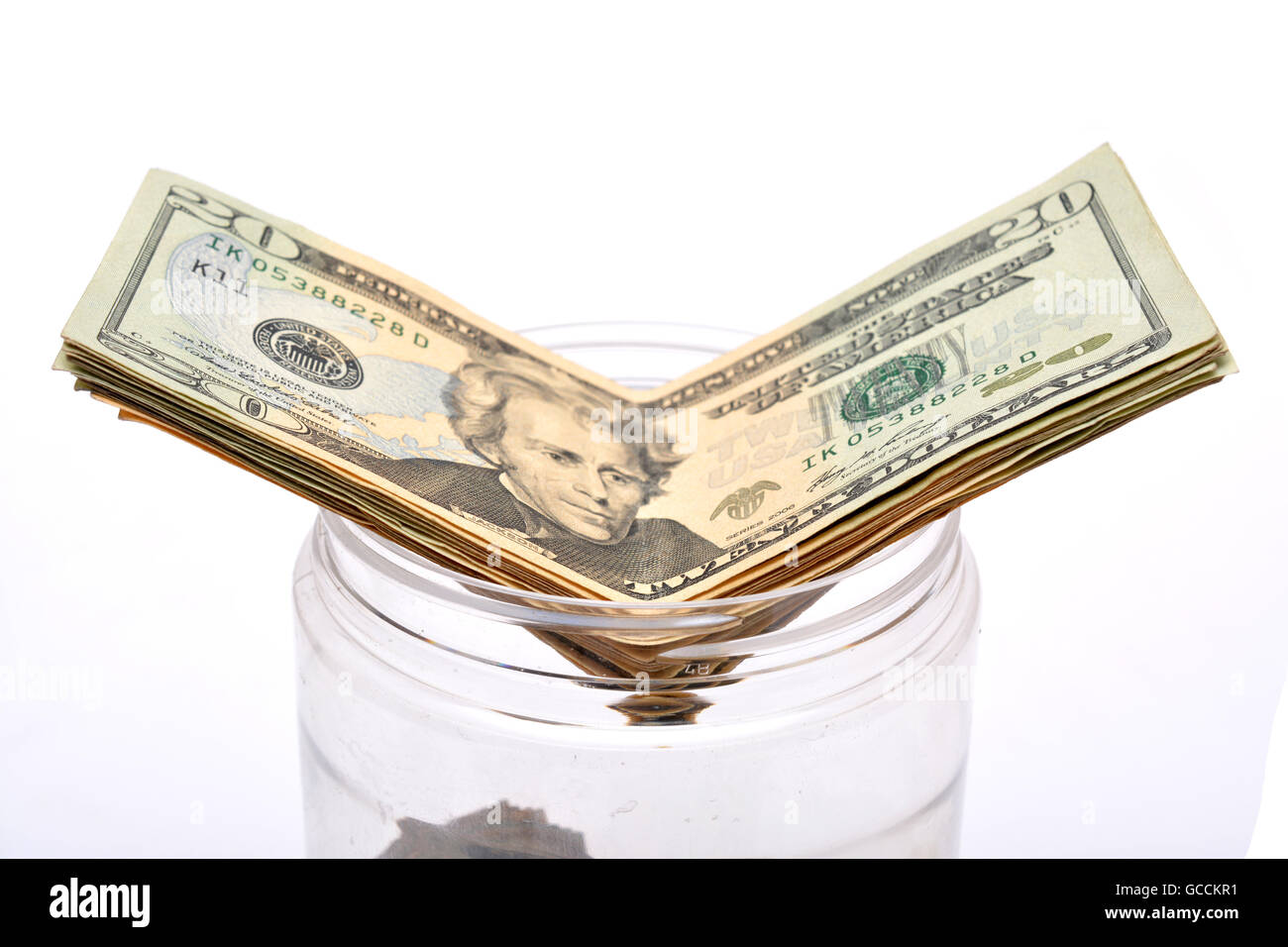 Il concetto di risparmio di dollari andando in vaso. Foto Stock