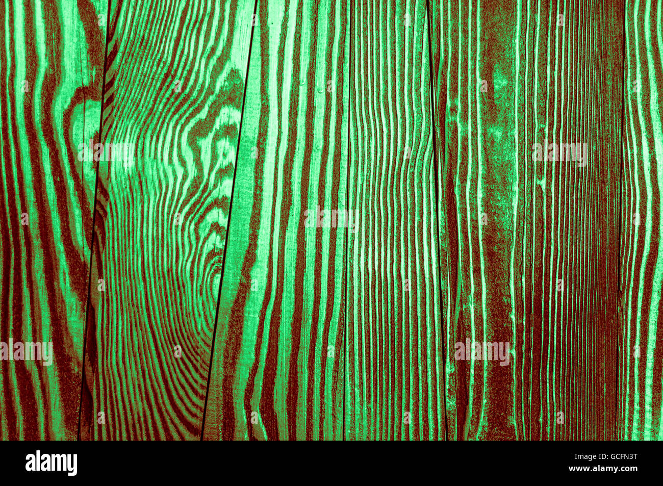 Perfetta luce verde scuro rossiccio irregolari di colore verdastro vecchio e ruvido legname Surface texture di sfondo Foto Stock