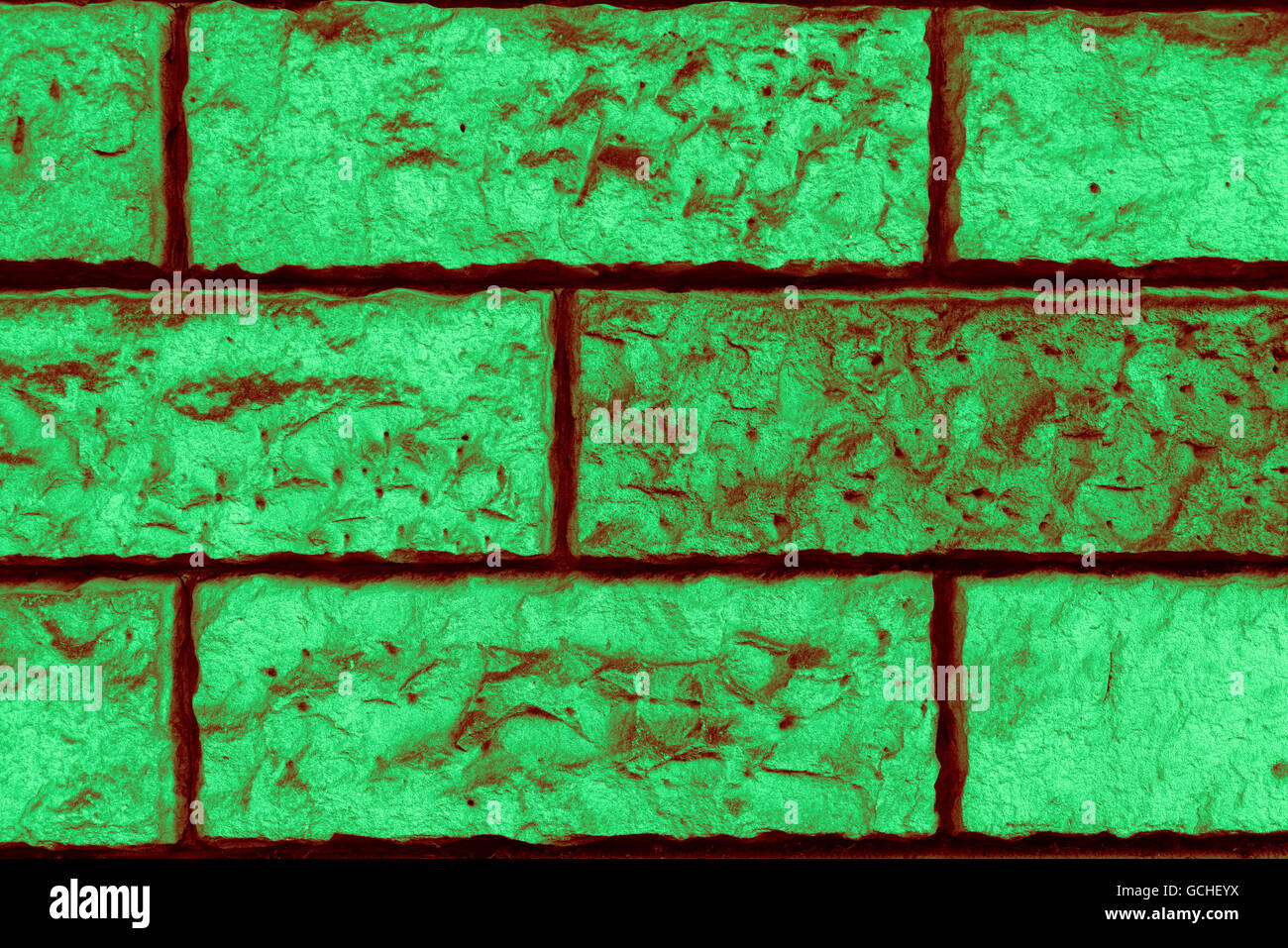 Perfetta luce verde scuro tendente al rosso bruno verdastro ad alta risoluzione urbano naturale muro di mattoni in background Foto Stock