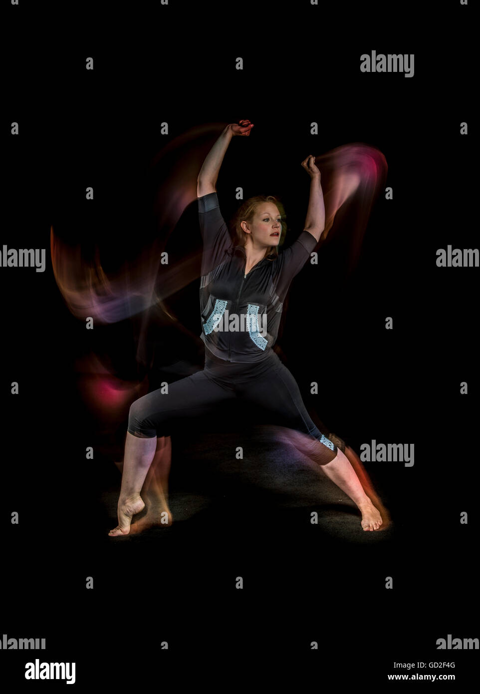 La ballerina donna luce sfocatura di movimento Foto Stock