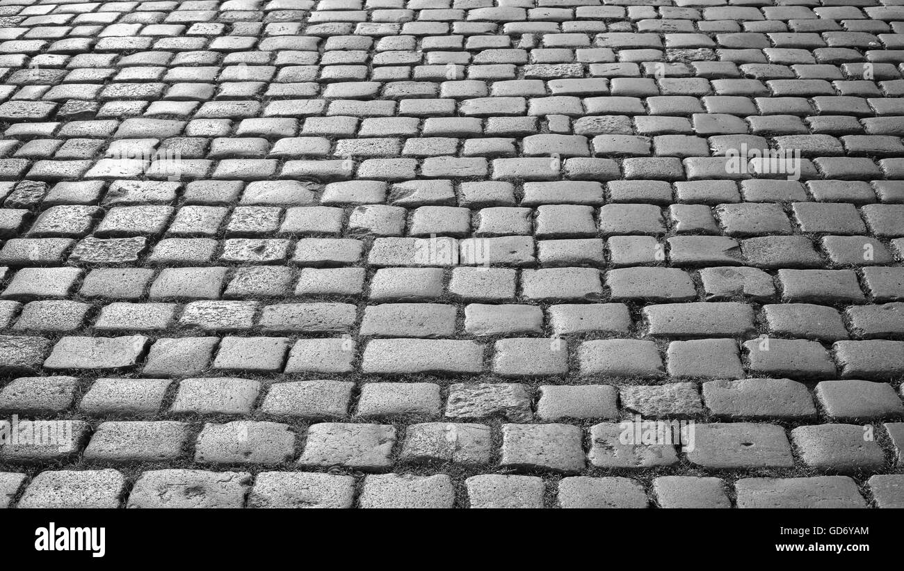 Foto in bianco e nero di cobblestone pavement. Foto Stock