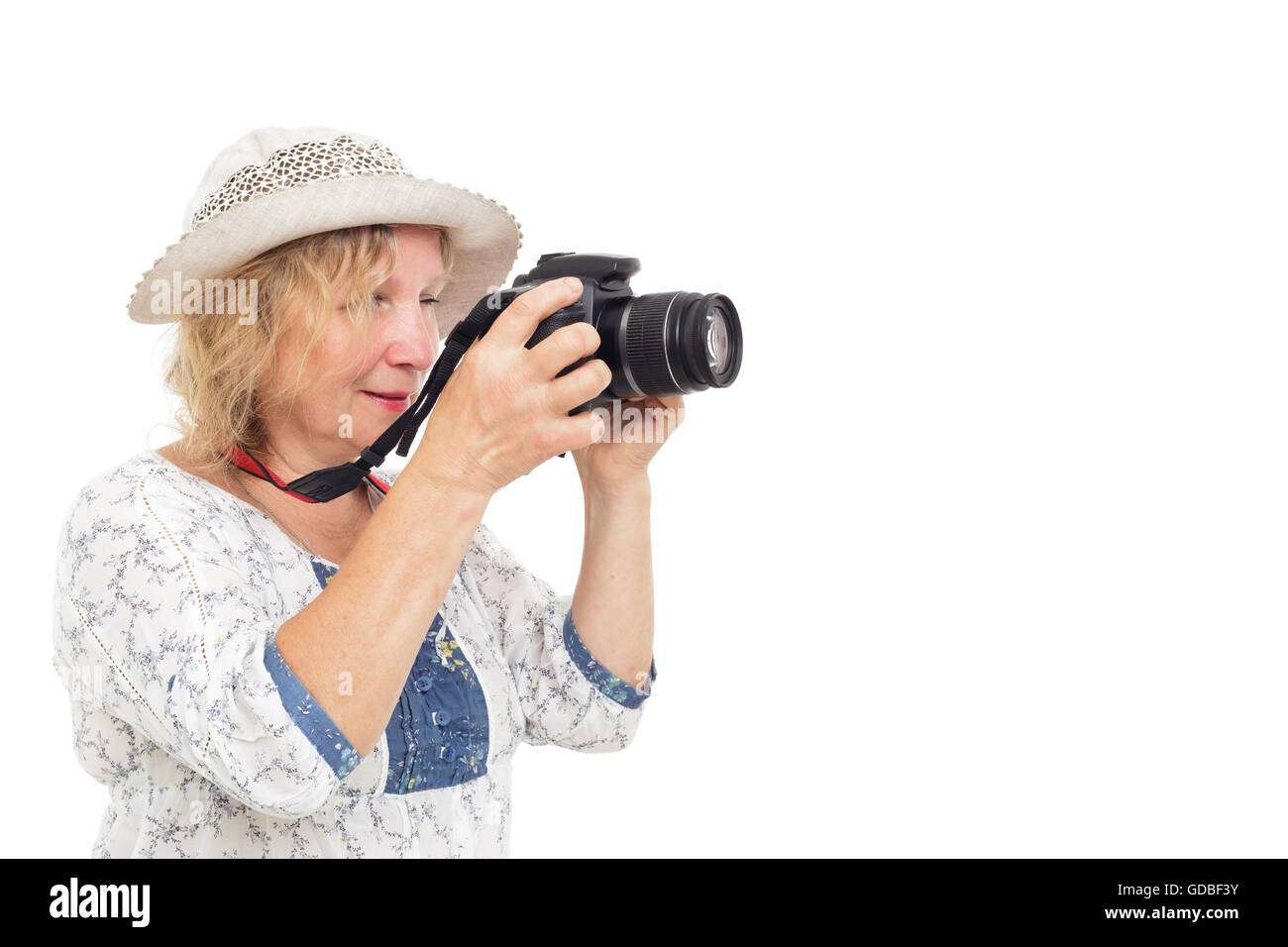 La donna impara a contenere fotocamera e comprensione delle impostazioni Foto Stock