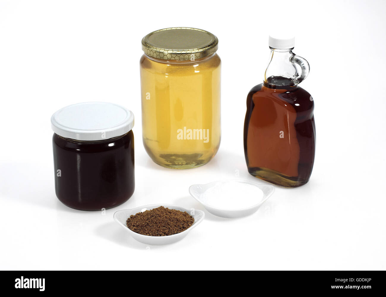 Zucchero semolato, lo zucchero di canna e sciroppo di acero, sciroppo di melassa e miele Foto Stock