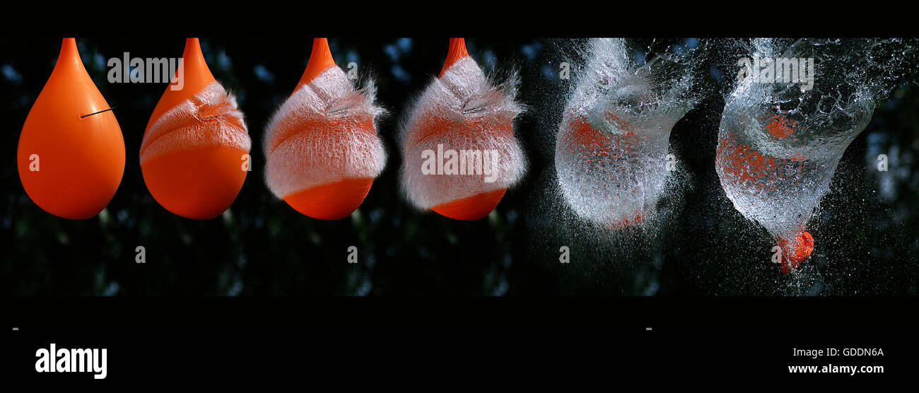 Shot rottura riempito di acqua palloncino arancione Foto Stock