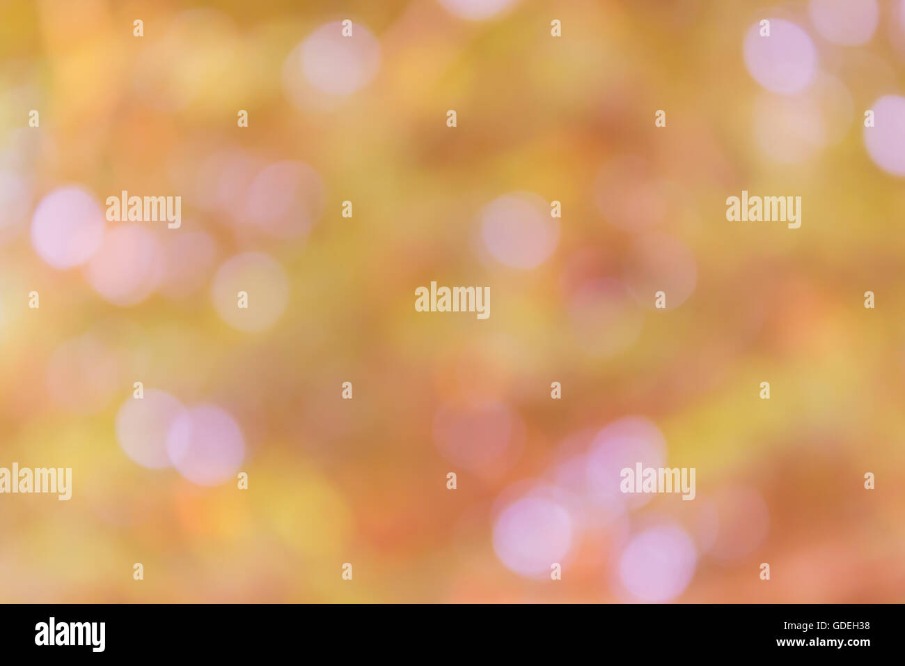 Bella scintilla sognante e soffiare bokeh di fondo naturale nella meravigliosa fantasia arancio pastello rosa sullo sfondo Foto Stock