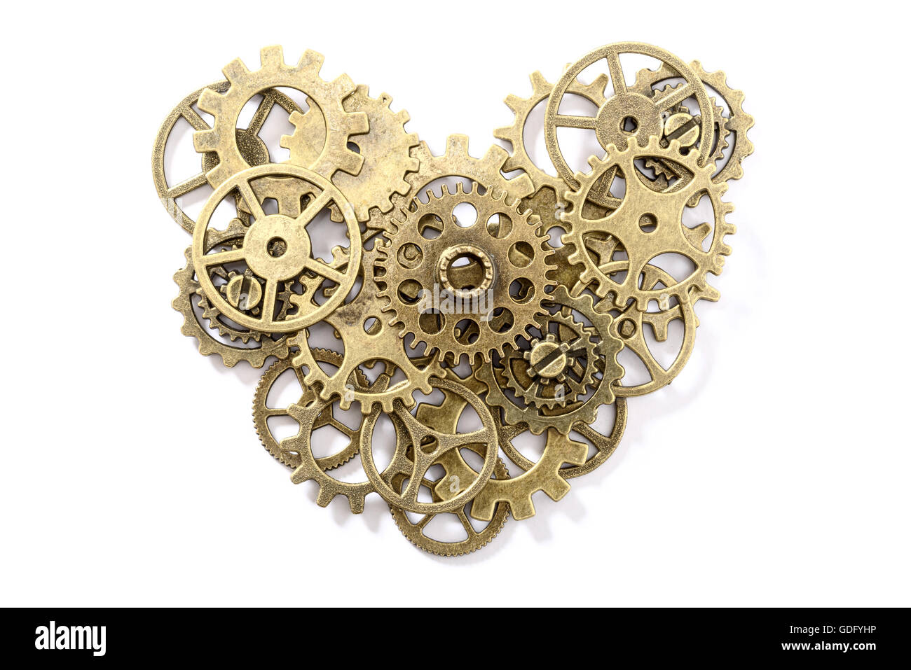 Ingranaggio in bronzo cuore su bianco, vista dall'alto Foto Stock