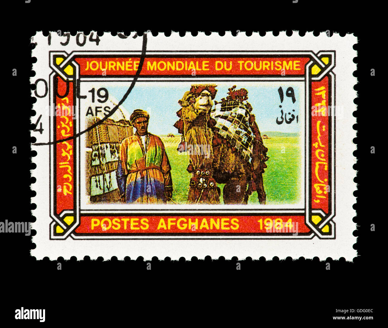 Francobollo da Afghanistan raffigurante un cammello driver, tenda e cammelli, rilasciata in occasione della Giornata Mondiale del Turismo (1984) Foto Stock