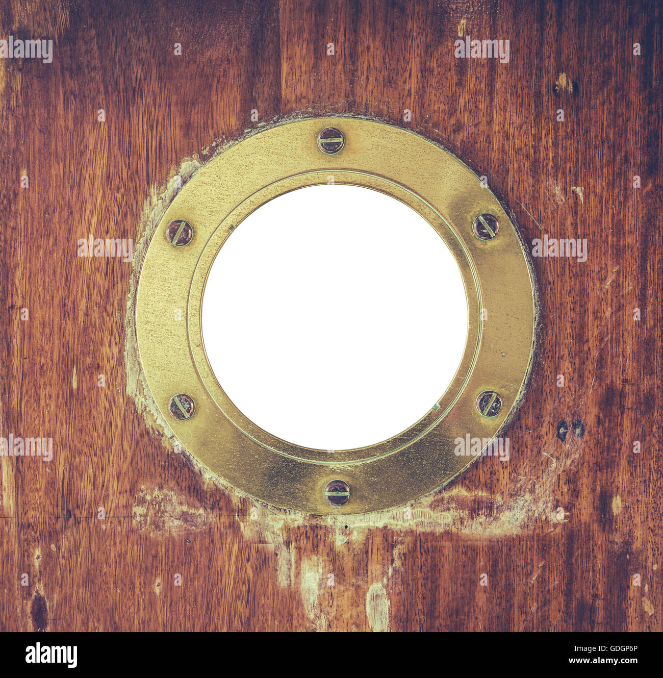 Ottone Vintage oblò in una nave della porta Foto Stock