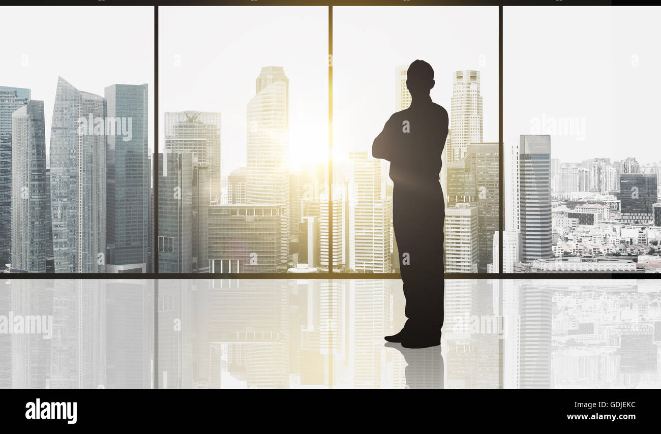 Silhouette di business man su sfondo di office Foto Stock