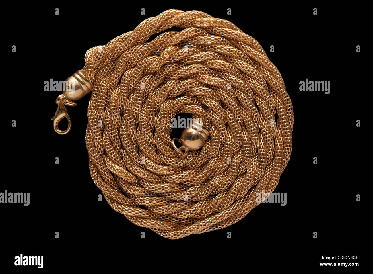 Golden collana catena su blackground Foto Stock